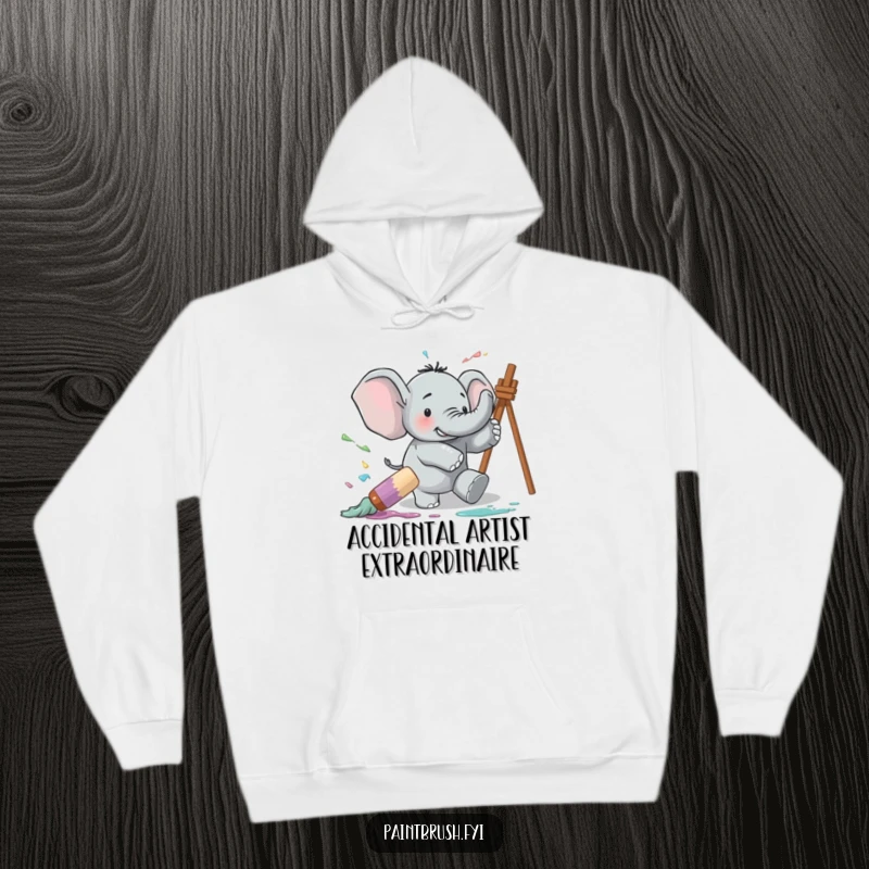 Funny hoodie featuring a clumsy elephant tripping over a giant paintbrush, creating a comical and colorful paint explosion.