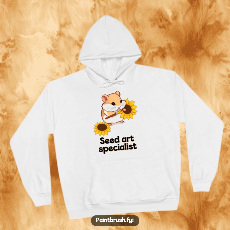 Funny hoodie featuring a curious hamster delicately painting a sunflower seed with a tiny paintbrush, showcasing miniature artistic skills.