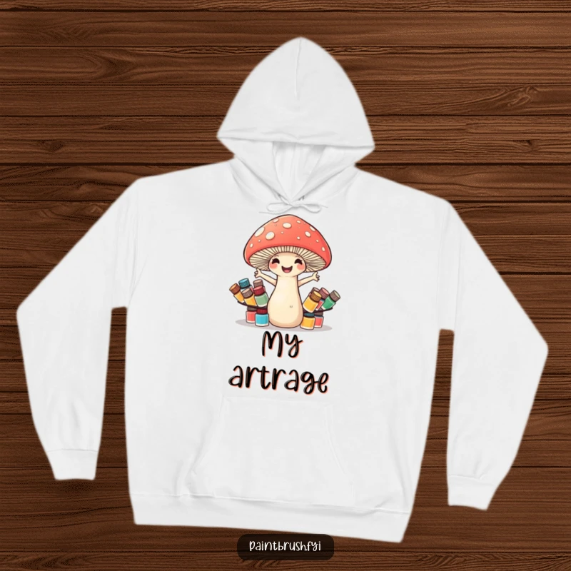 Funny mushroom hoodie featuring a cheerful mushroom artist attempting to balance many small paint pots, emphasizing creative struggle.
