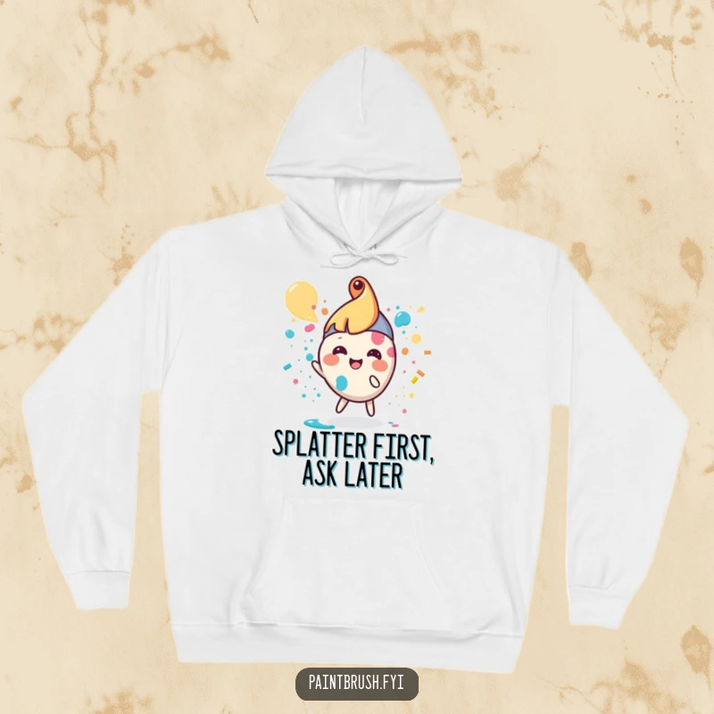 Funny paintbrush hoodie featuring a small, round character joyfully splattering paint, cozy and artistic.