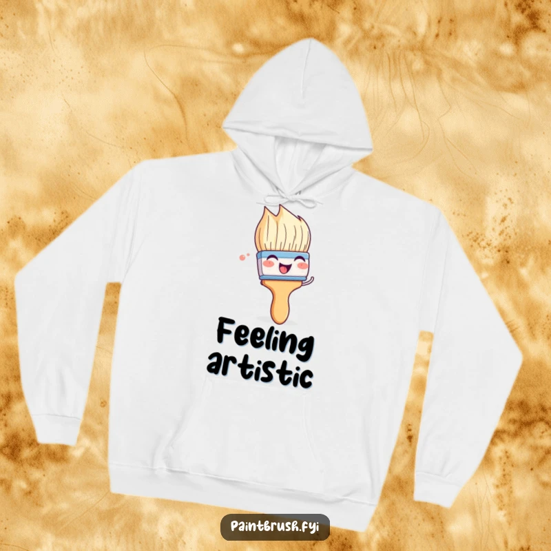 Funny paintbrush hoodie featuring a character playfully wiggling its bristles with glee, offering cozy comfort and artistic fun.