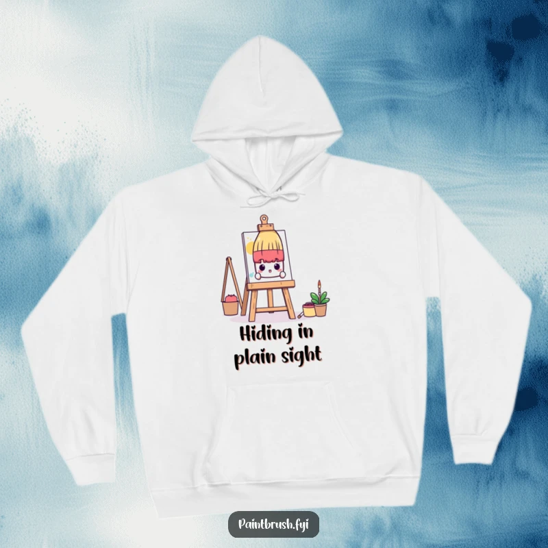 Funny Hoodie: A shy paintbrush character peeks from behind a huge art easel, offering cozy humor for introverted artists.