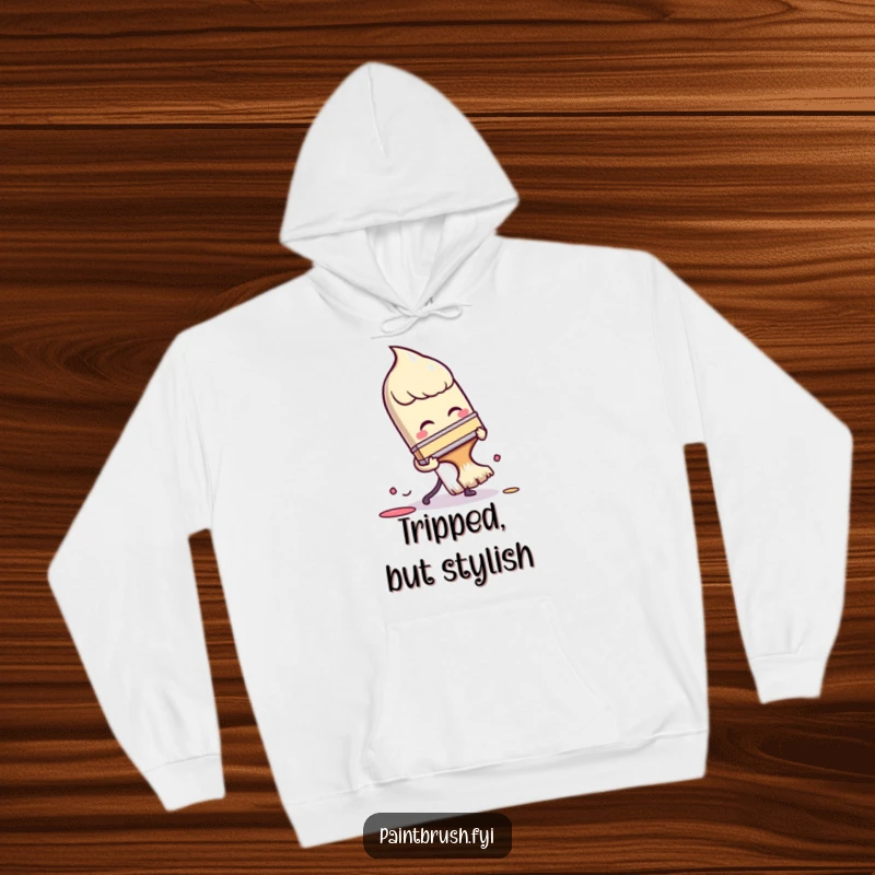 Funny Hoodie: A paintbrush character comically tripping over its own bristles, perfect for cozying up after a funny artistic accident.