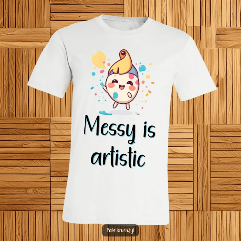 Funny paintbrush t-shirt featuring a small, round character joyfully splattering vibrant paint, artistic design.