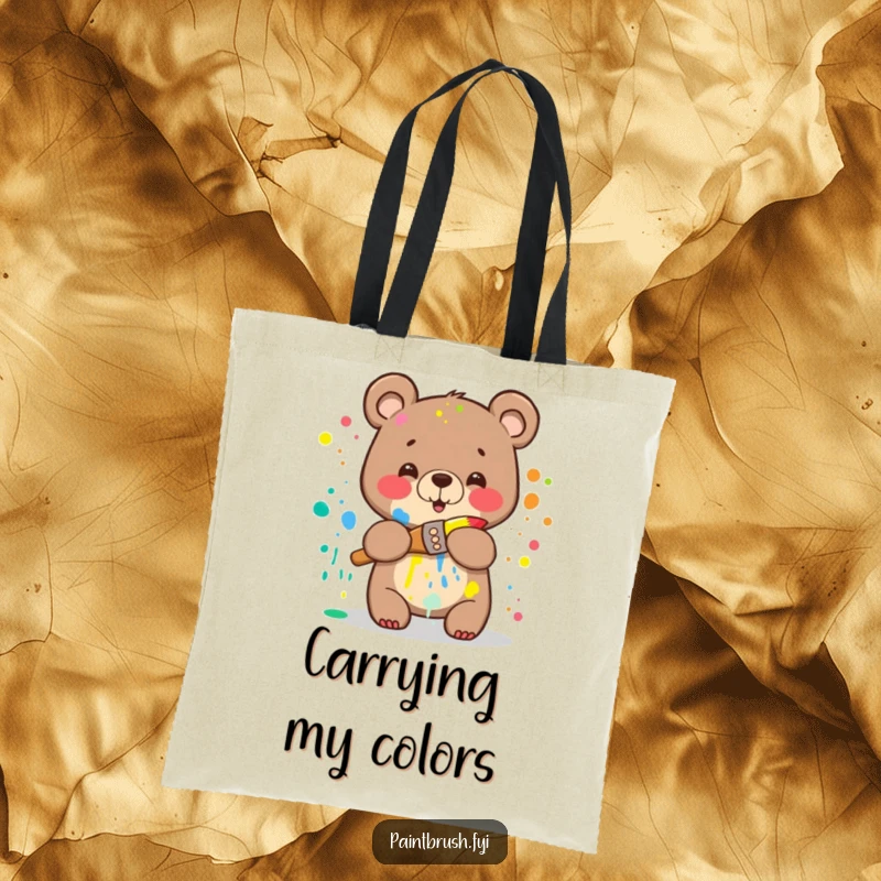 Funny Bear Tote Bag: A happy bear splattered with rainbow paint attempting to hug a paintbrush, ideal for carrying art supplies with humor.