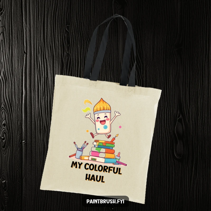 Funny Tote Bag: A joyful paintbrush character leaps over colorful art supplies, perfect for humorously carrying art essentials.